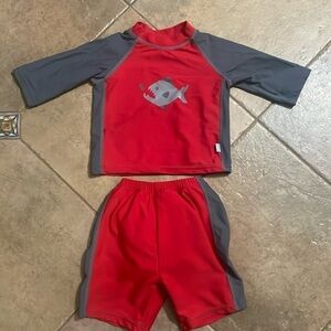I play boys shark swim shirts and shirt size 12 months